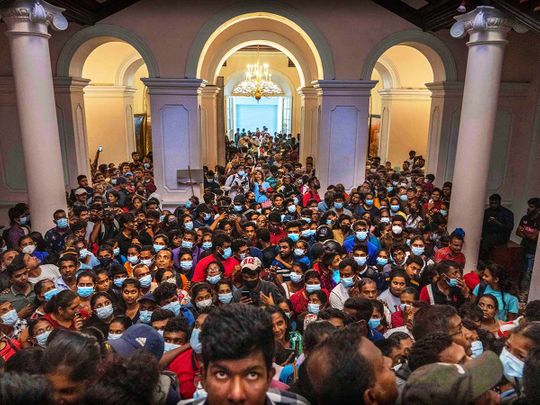 People throng President Gotabaya Rajapaksa’s official residence for the second day after it was stormed in Colombo, Sri Lanka, Monday, July 11, 2022. 