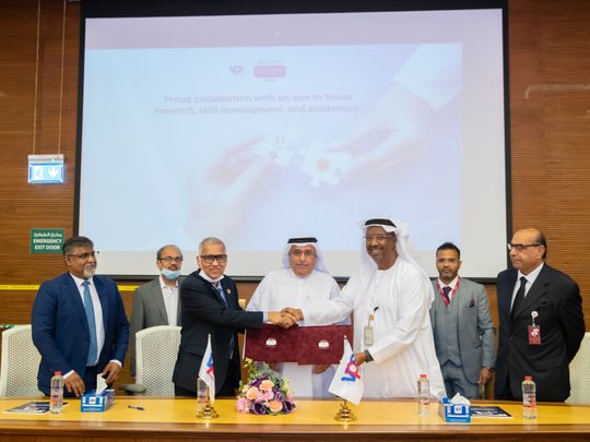 Burjeel Hospital and RAKMHSU officials exchanging MoU documents during the signing ceremony held at Burjeel Hospital Abu Dhabi.