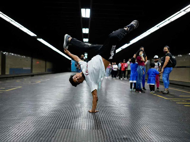 Kenyer Mendez performs at a metro station in Caracas. 