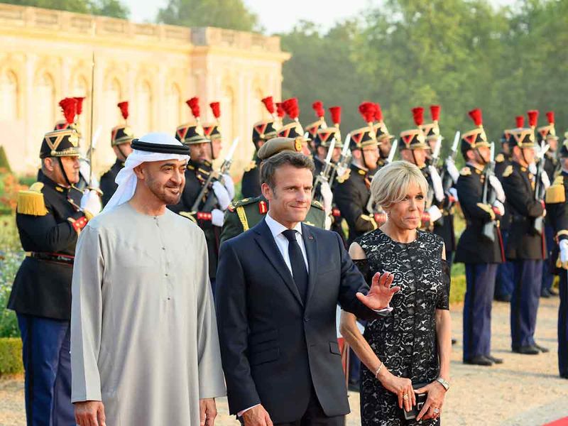 Sheikh Mohamed (left) arrives for a dinner reception hosted by Emmanuel Macron, President of France (2nd left), at the Versailles Grand Trianon. Seen with Mrs Brigitte Macron (3rd left).
