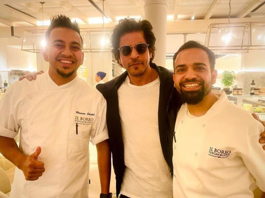 Shah Rukh Khan with chefs at an Italian bistro in London