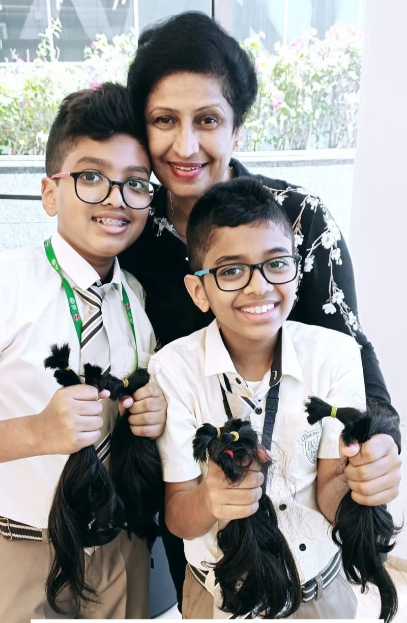 Premi Mathew with two boys who previously donated hair-1658581448745
