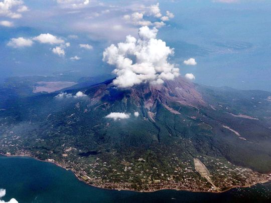 This aerial photo shows Sakurajima volcano in Kagoshima, southern island of Kyushu, Japan, one day after its eruption, Monday, July 25, 2022. The volcano spewed ash and large rocks into the nighttime sky on Sunday.
