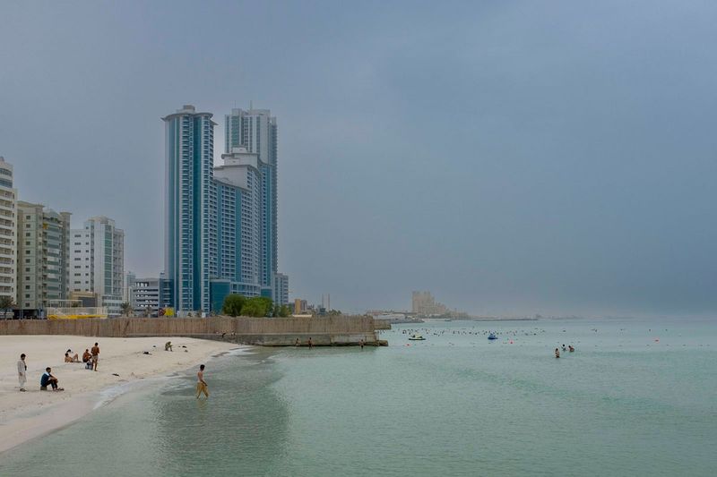Over cast and dusty weather in Ajman. 26th July 2022.