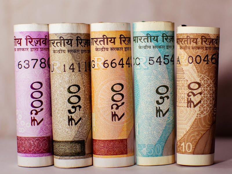 Indian rupee set to trade near historic low in coming three months