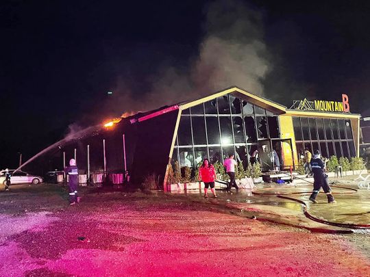 Firefighters working to contain a fire at the Mountain B nightclub in Sattahip district in Thailand's Chonburi province. 