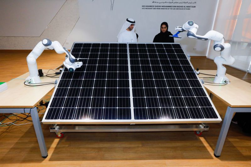 robots working on solar panels at R&D center DEWA-1660482574197