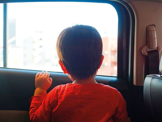 Child inside a car, child in car, child in a car