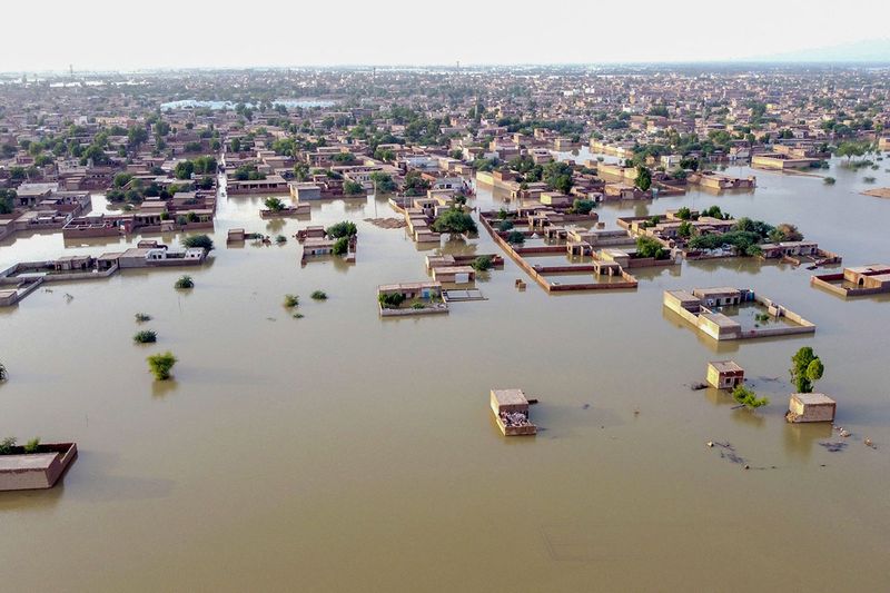 This aerial view shows a flooded residential area after heavy monsoon rains in Balochistan province on August 29, 2022. - The death toll from monsoon flooding in Pakistan since June has reached 1,136, according to figures released on August 29 by the country's National Disaster Management Authority.