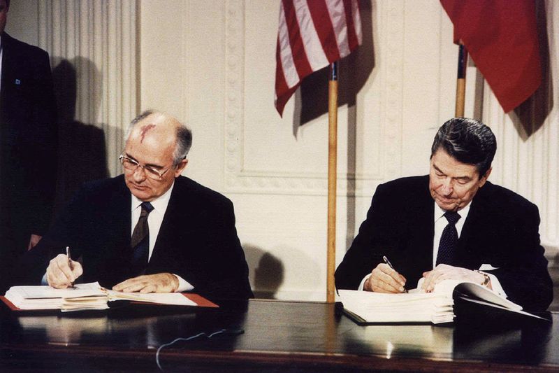 US President Ronald Reagan (R) and Soviet President Mikhail Gorbachev signing the Intermediate-Range Nuclear Forces (INF) treaty at the White House, Washington on December 8 1987. 