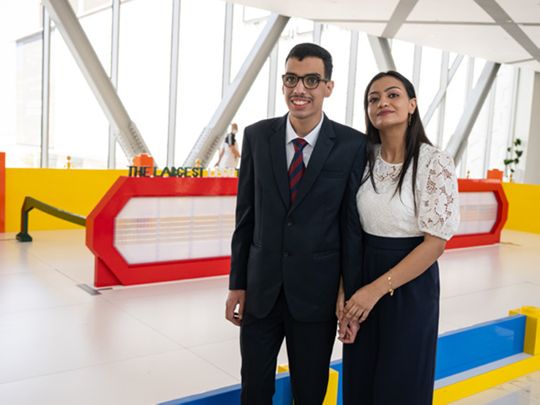NEW-Zeyad-Ibrahim-and-Salma-standing-in-front-of-the-largest-LEGO-brick-eyeglasses-1662369802884