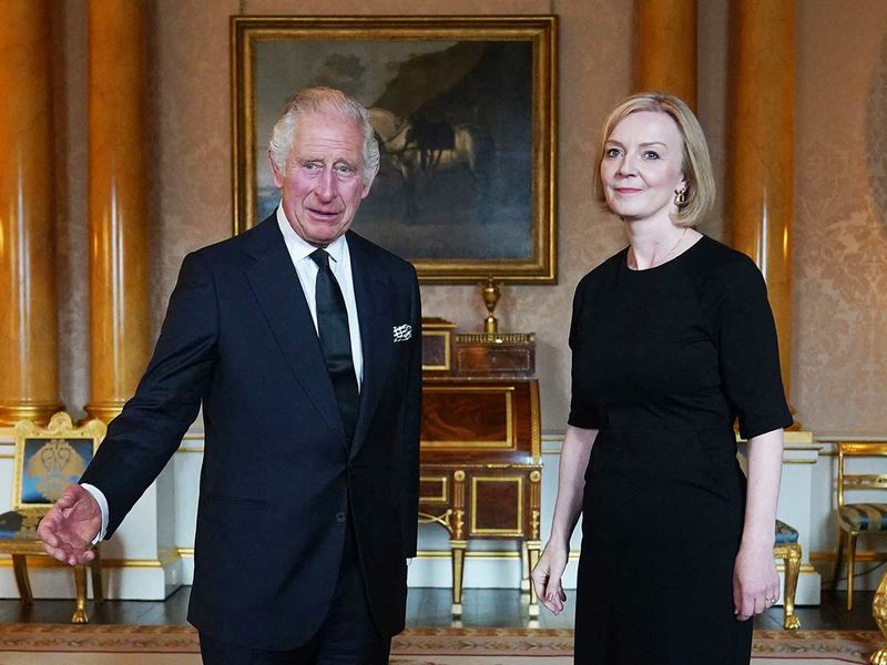 Britain's King Charles III (L) speaks with Britain's Prime Minister Liz Truss (R)during their first meeting at Buckingham Palace in London on September 9, 2022.