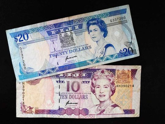 Fiji $10 and $20 bills bills are pictured in Sydney, Saturday, Sept. 10, 2022. 