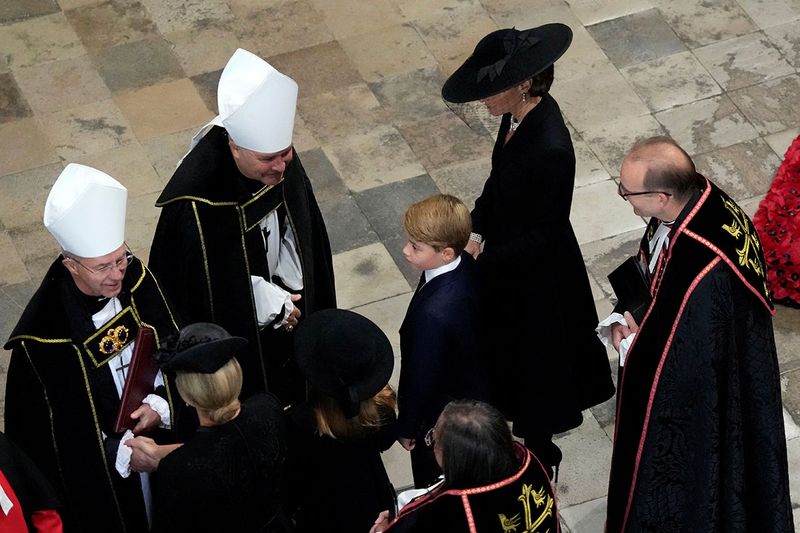 Britain's Kate, Princess of Wales, center right, and Prince George, center, arrive for the State Funeral of Queen Elizabeth II at Westminster Abbey in central London