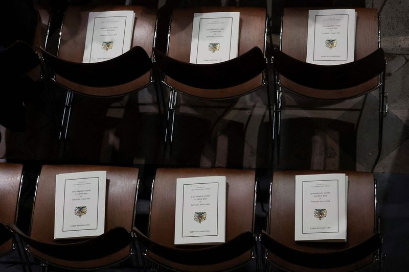 Funeral programs are left on chairs on the day of Britain's Queen Elizabeth II's State Funeral at Westminster Abbey in London.