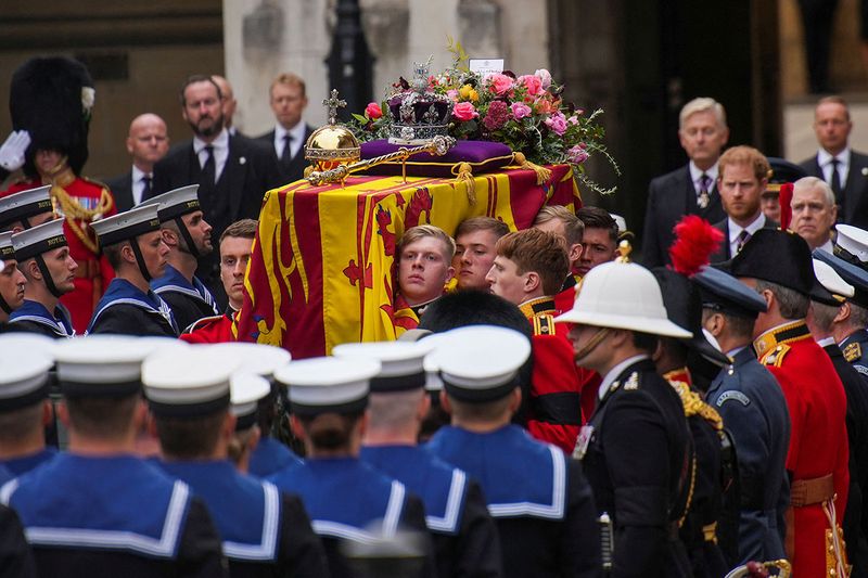 The coffin of Queen Elizabeth II is placed on a gun carriage during her funeral service in Westminster Abbey in central London.