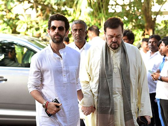 Bollywood actor Neil Nitin Mukesh and his father Nitin Mukesh arrive to attend the prayer meeting of legendary comedian Raju Srivastava, at ISKON Juhu, in Mumbai on Sunday.