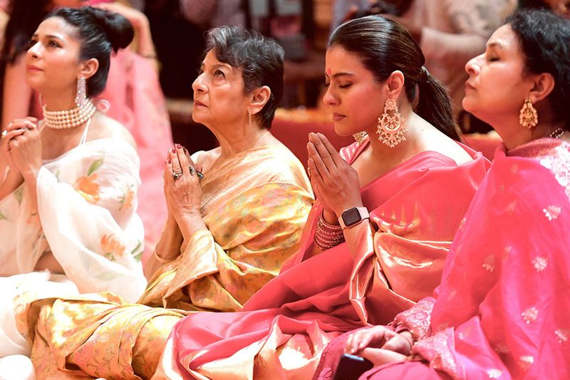 (From L-R) Bollywood actresses Tanishaa Mukerji, Tanuja, Kajol Devgan and Sharbani offer prayers during the celebrations to mark the 'Durga Puja' festival in Mumbai on October 2, 2022
