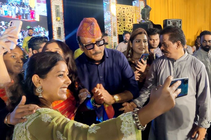Bollywood actor Jackie Shroff poses for a selfie during Navaratra Ustav organised by Shiv Sena leader Ravinder Pathak, at Sankalp Pratishthan, in Thane on Sunday.