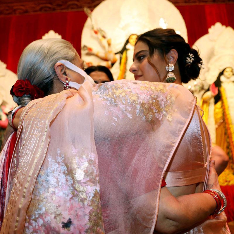 Bollywood actress Kajol and actress Jaya Bachchan embrace each other during the Durga Puja festival celebrations, in Mumbai on Monday.