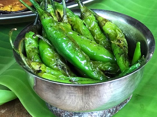 Lonka Bhaja - green chillies fried in the mustard oil left over from Begun Bhaja