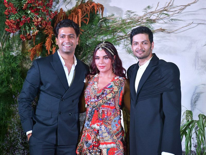 Mumbai, Oct 04 (ANI): Bollywood actor couple Ali Fazal and Richa Chadha with actor Vicky Kaushal posing for picture on the red carpet of their wedding reception, in Mumbai on Tuesday. (ANI photo)