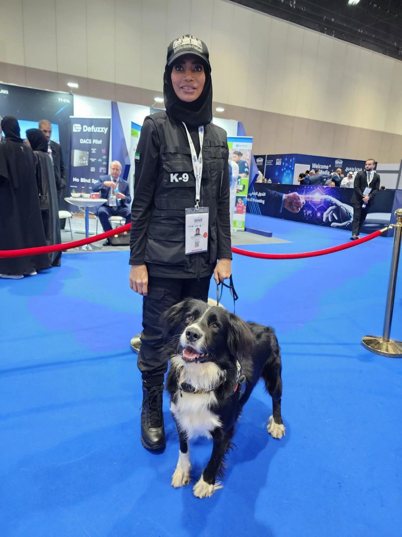 Fatima Al Jasmi with a trained dog in the Dubai Police K9 Unit-1665468289866