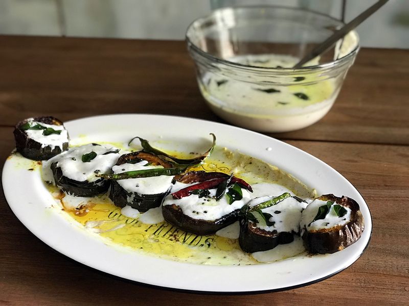 Fried eggplant in tempered yoghurt sauce