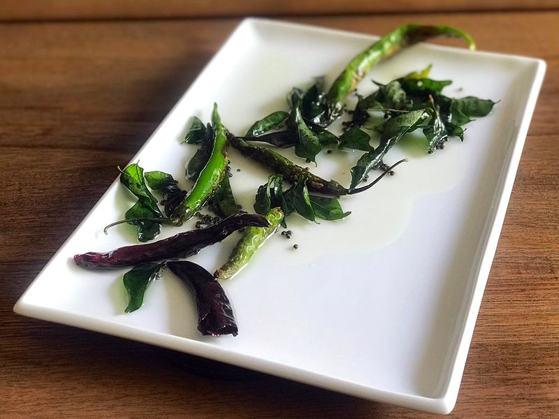 The simple tempering with fresh curry leaves, mustard seeds and whole chillies - both red and green, is truly versatile.