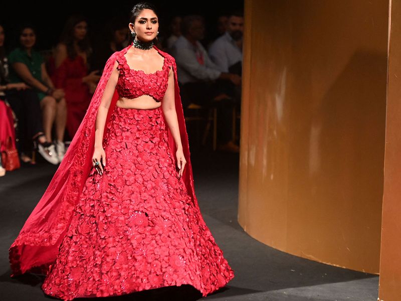 ‘Jersey’ star  Mrunal Thakur was the showstopper for designer Mishru. She looked stunning in a floral three piece crimson red lehenga.