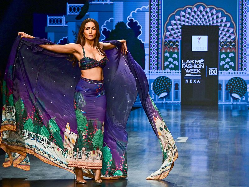 Bollywood actress Malaika Arora presents a creation by designer Limerick during the FDCI X Lakme Fashion Week in Mumbai on October 14, 2022.
