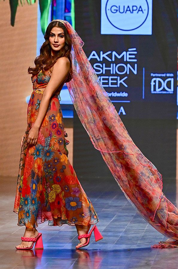Bollywood actress Rhea Chakraborty presents a creation by designer Guapa during the of the FDCI X Lakme Fashion Week in Mumbai on October 14, 2022