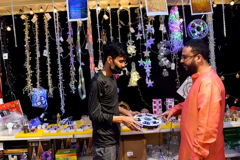 Residents buying decorative lights for Diwali celebrations at Madhoor supermarket in Karama. 