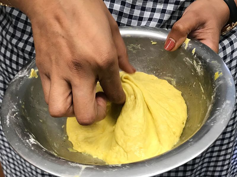 The dough for making Kara Poli is softened by adding oil