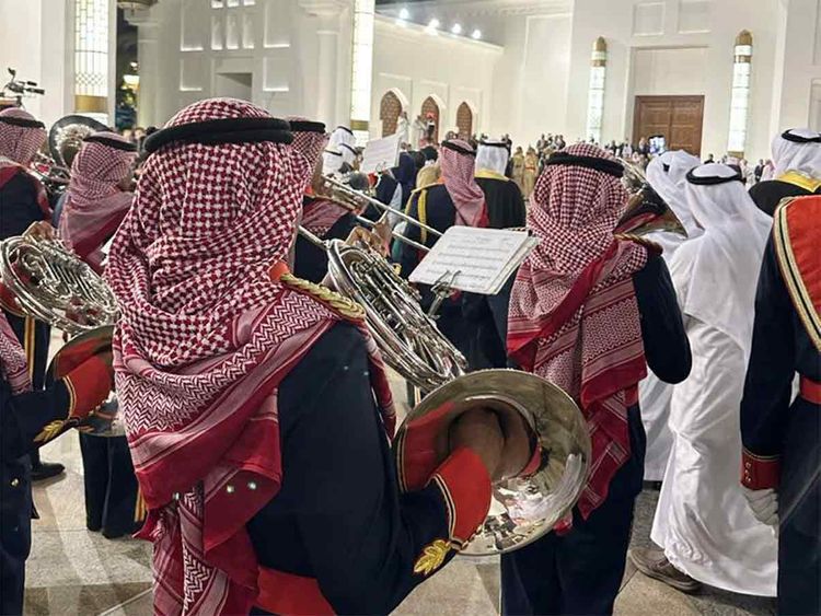 A ceremonial band plays music as Pope Francis and King Hamad leave the venue after the welcome ceremony.
