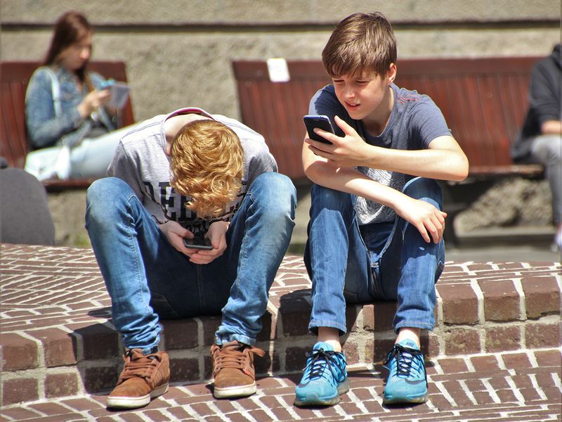 teenagers using phone
