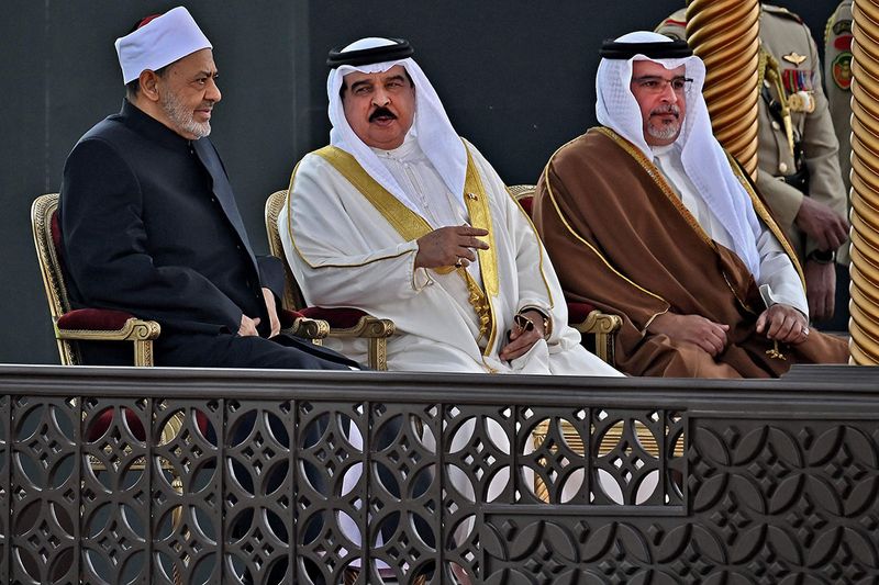 Grand Imam of al-Azhar mosque Sheikh Ahmed Al-Tayeb, Bahrain's King Hamad bin Isa al-Khalifa, and Bahrain's Crown Prince Salman bin Hamad al-Khalifa take part in a welcome ceremony for Pope Francis at Sakhir Royal Palace.