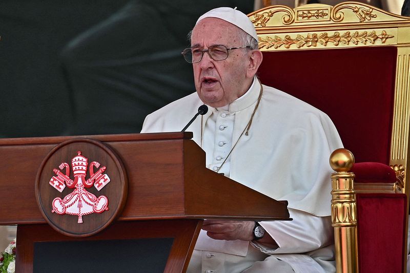 Pope Francis delivers a speech during a ceremony alongside the Grand Imam of al-Azhar mosque Sheikh Ahmed Al-Tayeb and Bahrain's King Hamad bin Isa al-Khalifa at Sakhir Royal Palace, in Manama.  