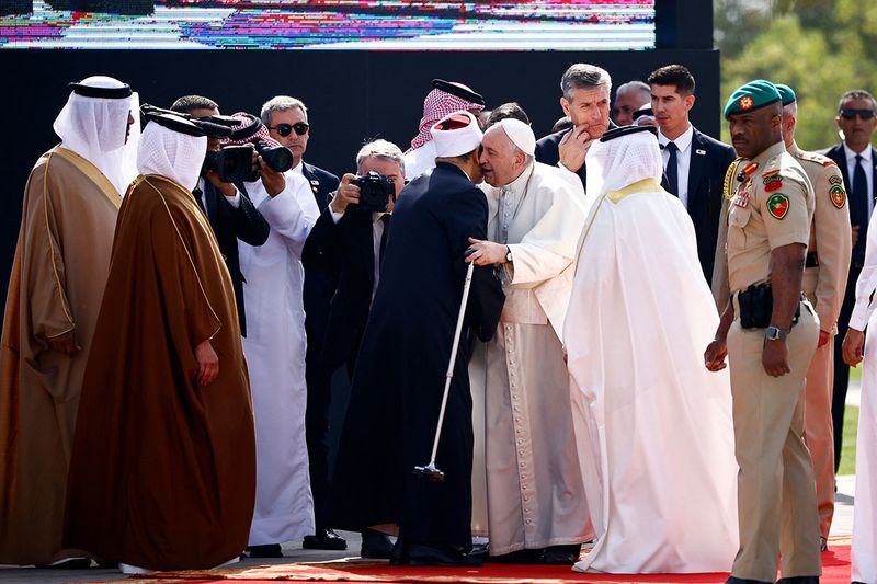 Pope Francis greets Grand Imam of Al-Azhar Ahmed Al-Tayeb as they attend the Bahrain Forum for Dialogue: East and West for Human Coexistence at Al-Fida' Square of Sakhir Royal Palace during Pope Francis' apostolic journey, south of Manama, Bahrain, November 4, 2022. 