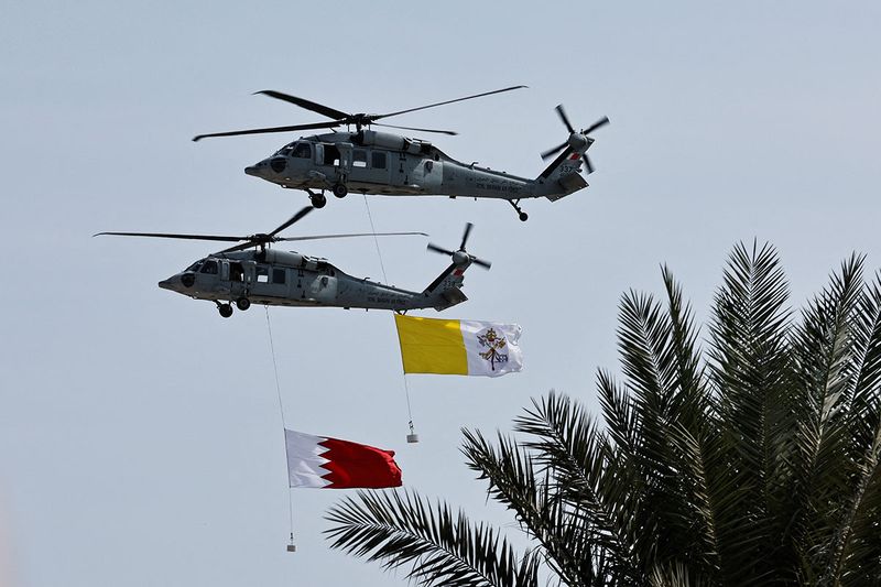 Royal Bahraini Air Force display flags of Vatican City and Bahrain during the Bahrain Forum for Dialogue: East and West for Human Coexistence at Al-Fida' Square of Sakhir Royal Palace during Pope Francis' apostolic journey, south of Manama, Bahrain. 