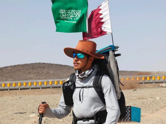  Saudi trekker Abdullah Alsulmi crosses a desert area near Al Khasrah area, some 350Km west of Riyadh, during his solo trek to the Qatari capital ahead of the FIFA World Cup. 