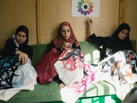 Women refugees empowered by 81 Designs recreating tatreez work