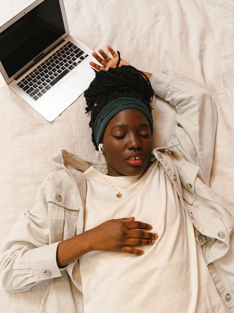 A woman listening to music while being asleep