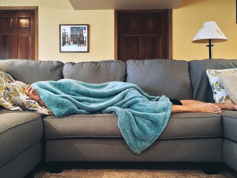 A woman sleeping on the couch 