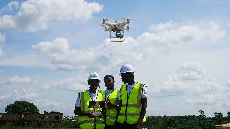 Mr. Haqq and two Okuafo staff members, Mumin Siba and Swabir Musah, conduct multispectral mapping of a farm in Ghana’s Eastern Region.