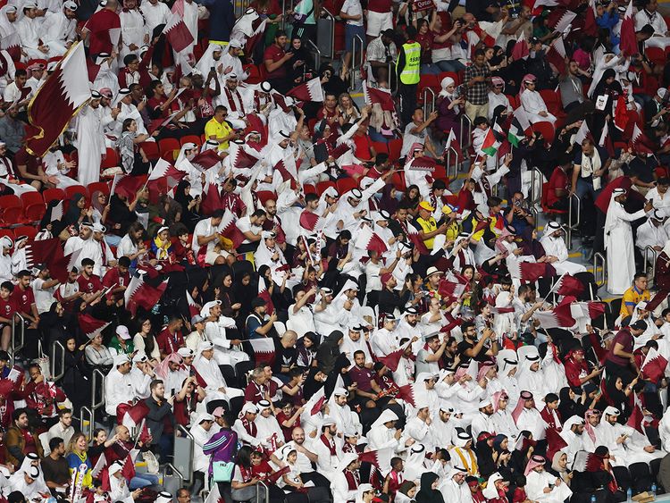 Fans of Qatar cheer ahead of the World Cup Group A football match between Qatar and Ecuador at the Al Bayt Stadium in Al Khor, Doha. 