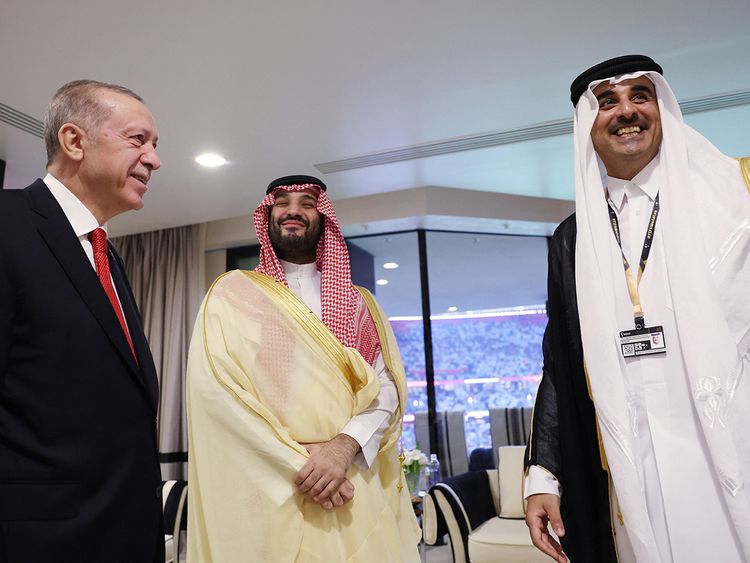 Turkish President Recep Tayyip Erdogan (L) meets with Saudi Arabia's Crown Prince Mohammed bin Salman Al Saud (C) as they are welcomed by Qatari Emir Sheikh Tamim bin Hamad Al Thani (R) on the occasion of the opening ceremony of the 2022 FIFA World Cup in Doha, Qatar. 