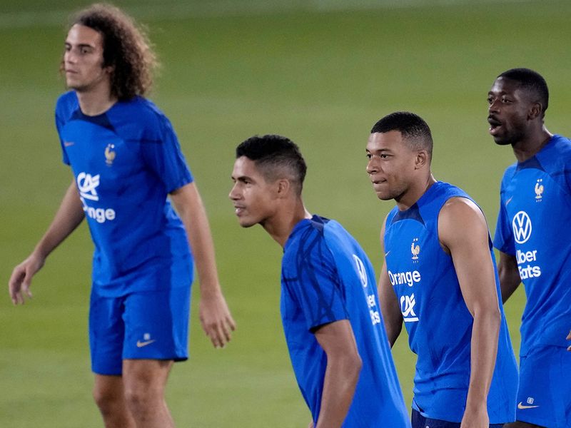 From left France's Matteo Guendouzi, Raphael Varane, Kylian Mbappe and Ousmane Dembele attend a training session at the Jassim Bin Hamad stadium in Doha. 