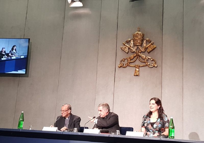 Cardinal Angelo Becciu (centre), prefect of the Congregation for Saints Causes, and Cardinal Gregorio Rosa Chavez (left), auxiliary bishop of San Salvador, at the Vatican press office in 2018. 