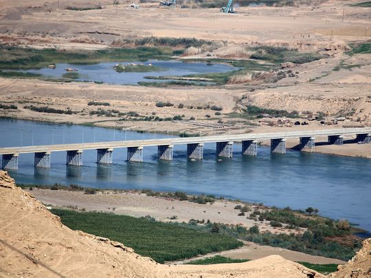 A bridge spans the Tigris river near the Makhoul dam site, in northern Iraq's Salaheddine province. 